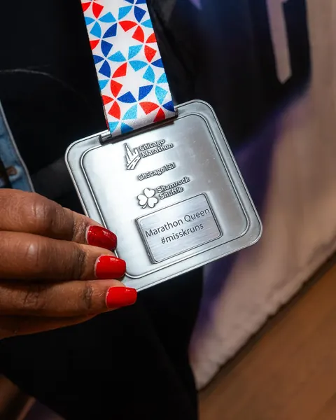 A Chicago Marathon finisher medal, engraved for its runner.