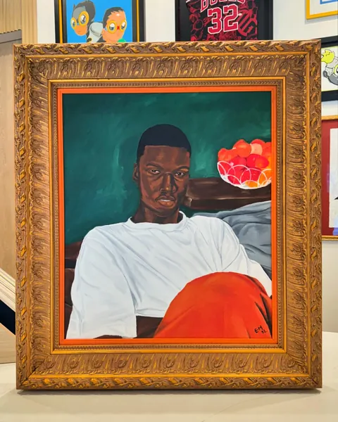 Matthew Eguavoen, Guy Portrait (Green Background), in a Frame Chicago frame.